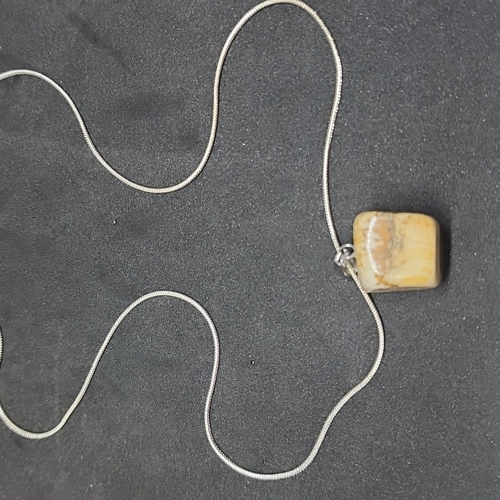 Natural tan stone on a 18” silver chain